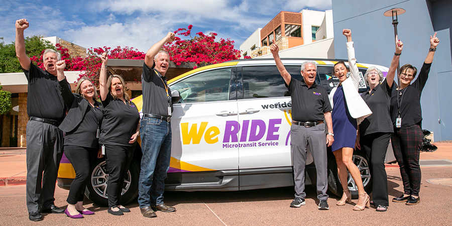 Bob Wingenroth, Mayor Hall, Vice Mayor Judd, Councilmember Cline, Assistant City Manager Tracy Montgomery and others pose for a photo in front of a WeRide van