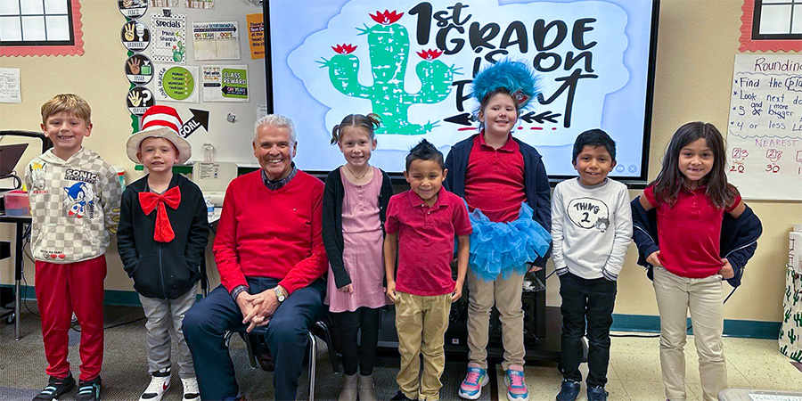 Mayor Hall takes a photo with students during Read Across America Week.