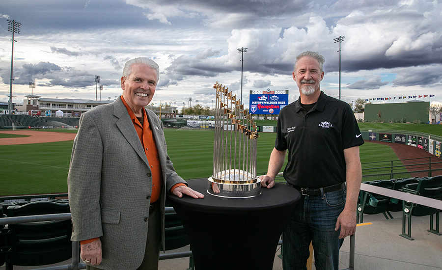 Mayor Hall and Councilmember Judd standing next to a trophy on a table