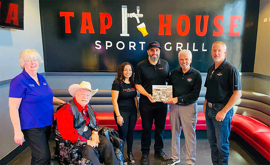 City Councilmembers pose for a picture with Tap House Sports Grill