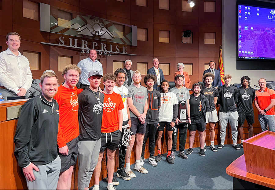 The OUAZ Men's Basketball team pose for a photo in the Council Chambers