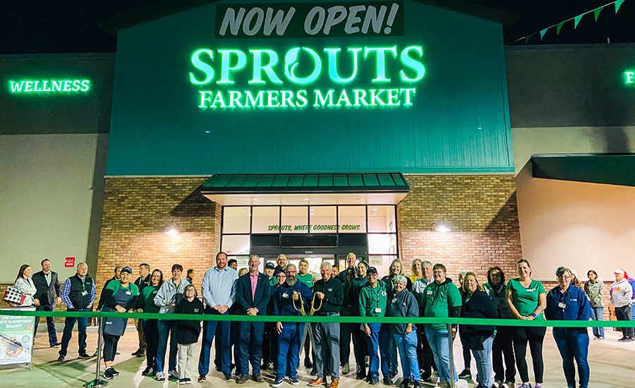 Surprise City Council joins Sprouts Farmers Market in front of their Prasada store for a ribbon cutting.