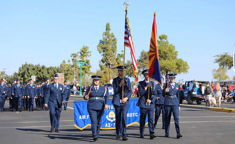 a group of people in uniform marching